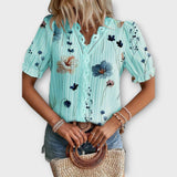 Bruna - Blusa elegante com um decote pontiagudo