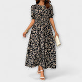 Amelia – Vestido com Decote Redondo e Padrão Floral